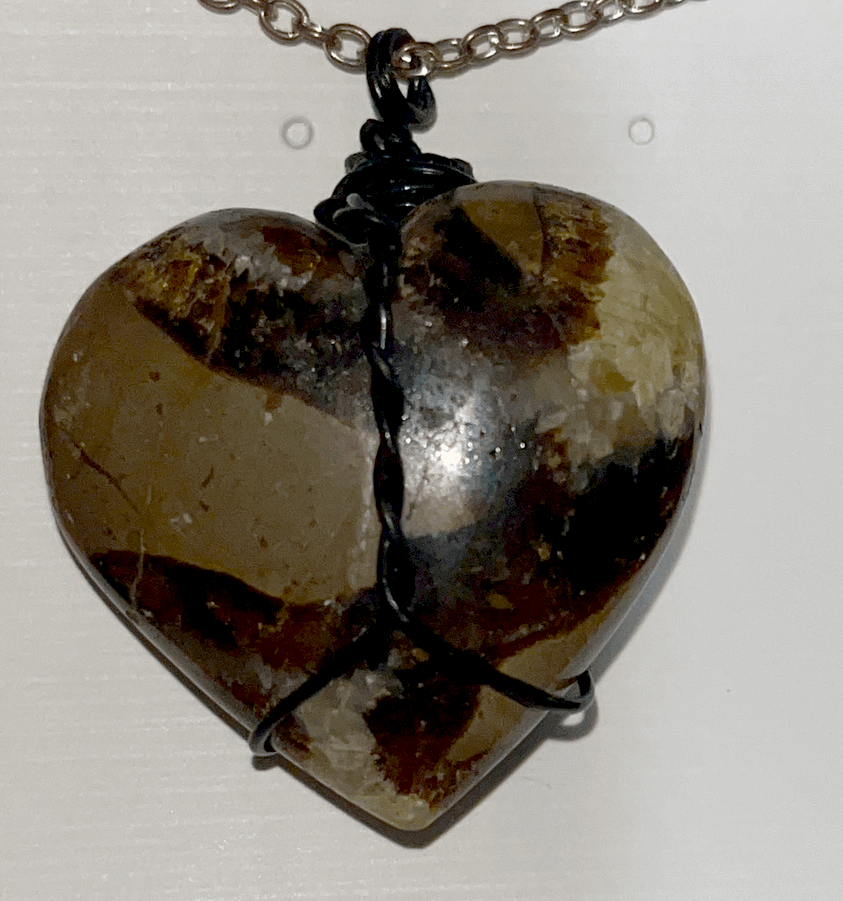 Handmade wire wrapped Septarian heart pendant necklace. UV reactive. Stability, fight addictions, powerful grounding and protection.