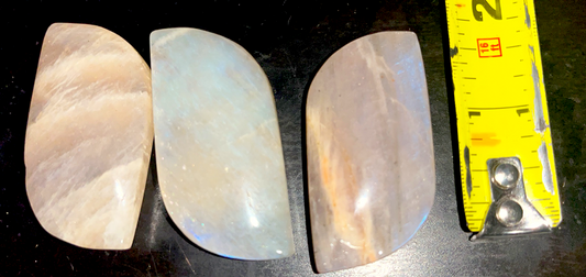 Peach Moonstone crystal palm stones with amazing flue flashing colors. Emotional balance and enhanced intuition and peace