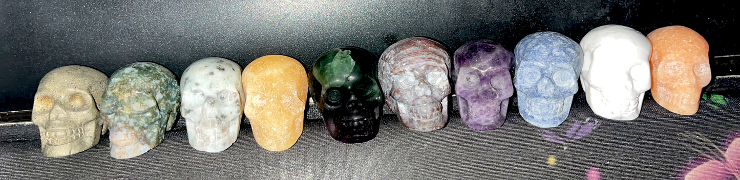 Natural Crystal carved mini skulls variety. Howlite, Amethyst, Jasper, Kiwi Jasper, Orange Calcite, Aventurine, Pyrite, Moss Agate
