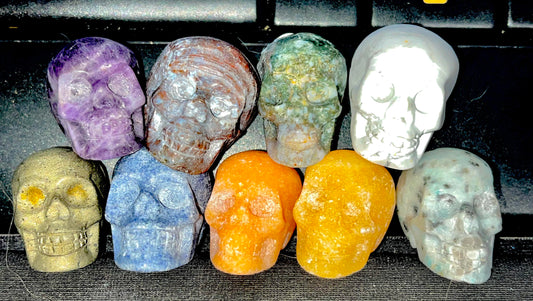 Natural Crystal carved mini skulls variety. Howlite, Amethyst, Jasper, Kiwi Jasper, Orange Calcite, Aventurine, Pyrite, Moss Agate