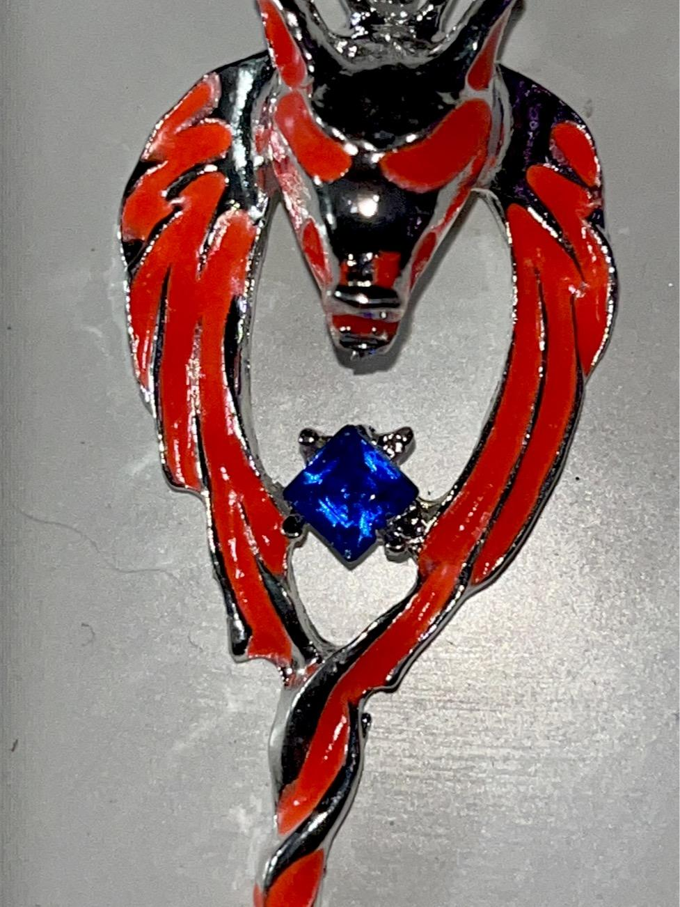 Red Glow in the dark wolf pendant necklace with blue rhinestone. Unique #wolf #wolflovers