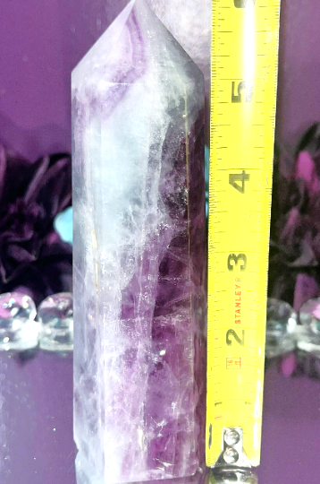 Rainbow Fluorite Obelisk tower with beautiful purple and blue hues. Brings focus, clears mind, enhance intuition, and promote mental clarity