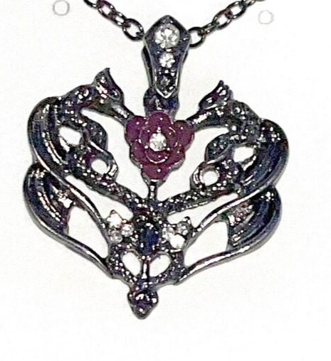 Double twin dragon necklace pendant with or without rhinestones. Comes w/rope chain necklace.