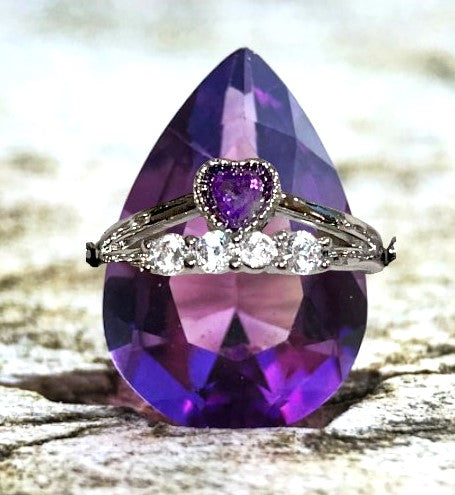 Amethyst heart crystal ring surrounded by row of cubic zirconia. Natural gemstone. Adjustable to fit all sizes.
