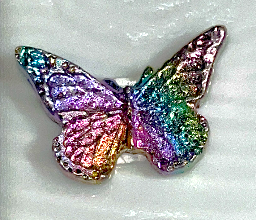 Rainbow bismuth carvings of Mermaid tails, butterflies, Mickey Mouse, Seahorses, and a froggie