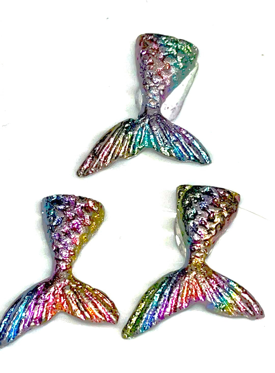 Rainbow bismuth carvings of Mermaid tails, butterflies, Mickey Mouse, Seahorses, and a froggie