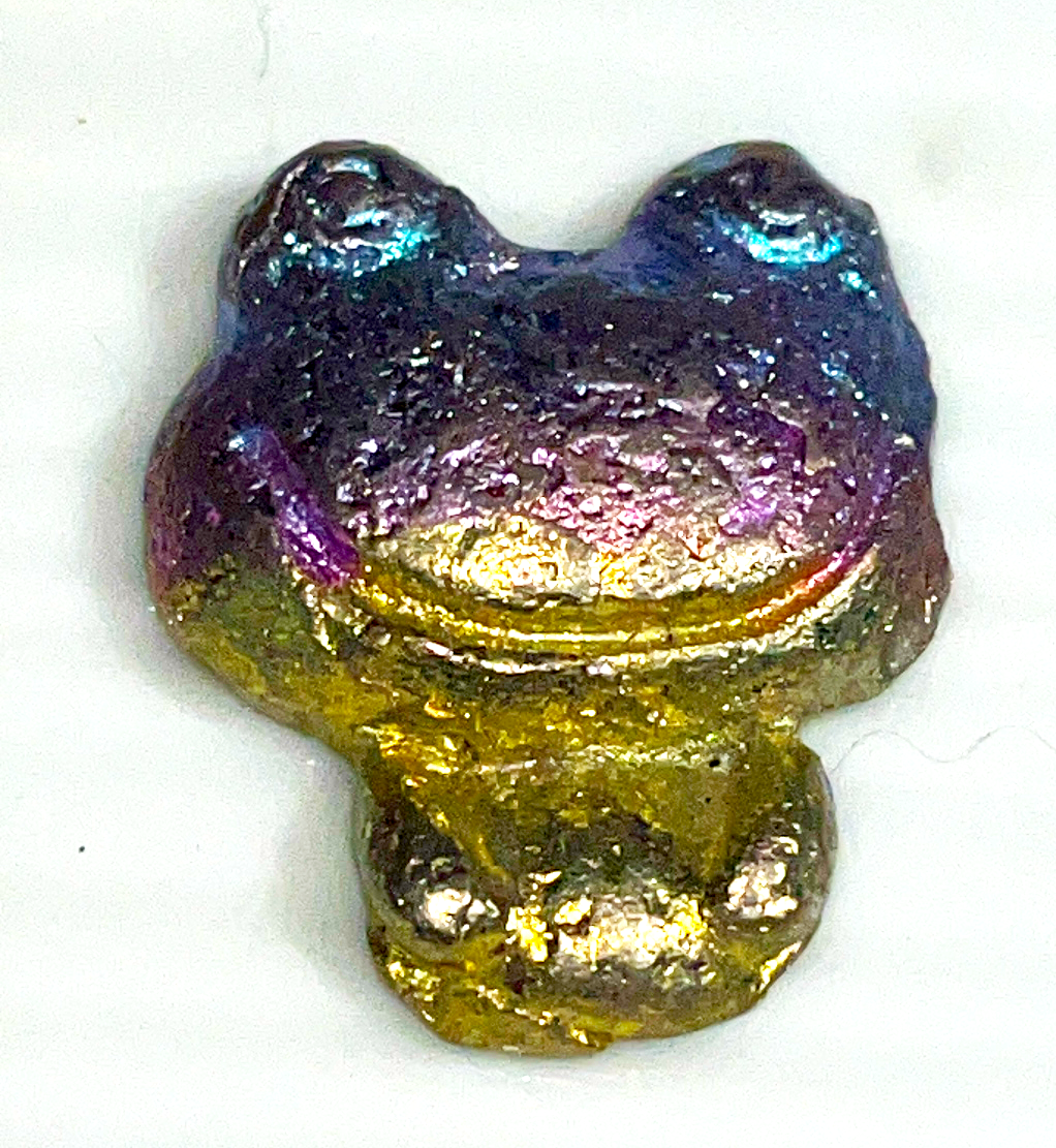 Rainbow bismuth carvings of Mermaid tails, butterflies, Mickey Mouse, Seahorses, and a froggie