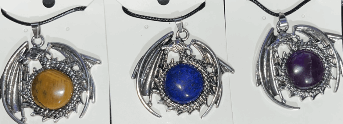 Flying Dragon pendants with natural crystal gemstones in center. Comes with adjustable black rope chain necklace.