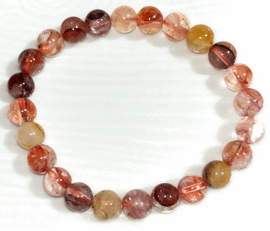 Fire Quartz 10mm crystal bracelet- clears away anxiety, mental distractions, fear, doubt, burns away any emotional baggage, gives courage