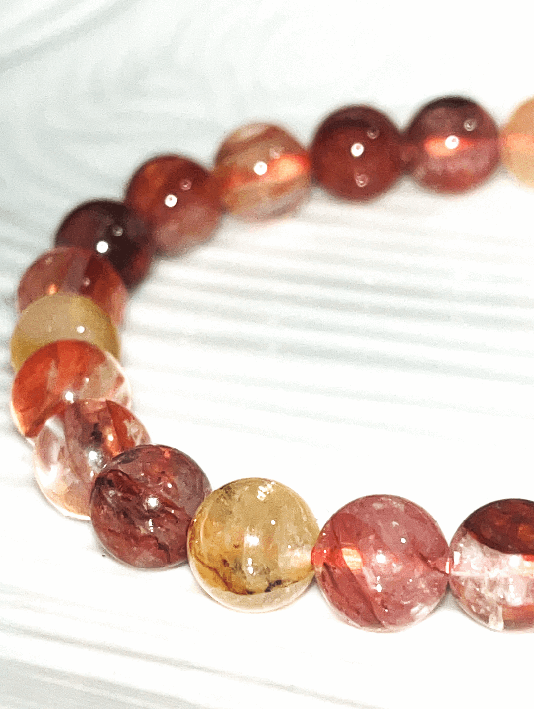 Fire Quartz 10mm crystal bracelet- clears away anxiety, mental distractions, fear, doubt, burns away any emotional baggage, gives courage