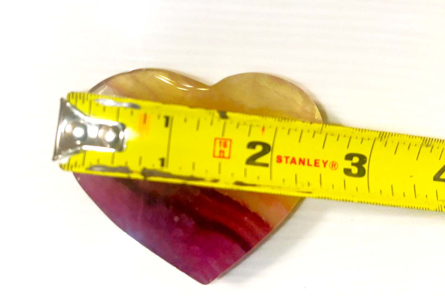 Large Yellow and purple Fluorite striped crystal heart carving. Beautiful colors! Brings focus, and peace