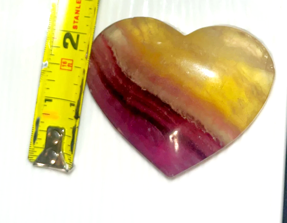 Large Yellow and purple Fluorite striped crystal heart carving. Beautiful colors! Brings focus, and peace