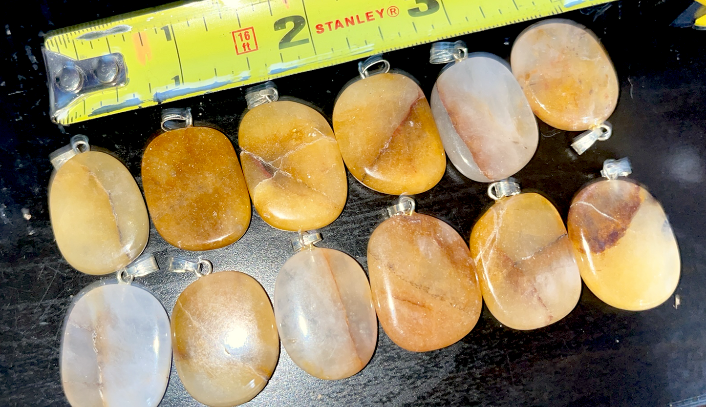 Natural Golden Healer oval shaped crystal pendant. A  master healer that possesses the amplifying properties of Clear Quartz