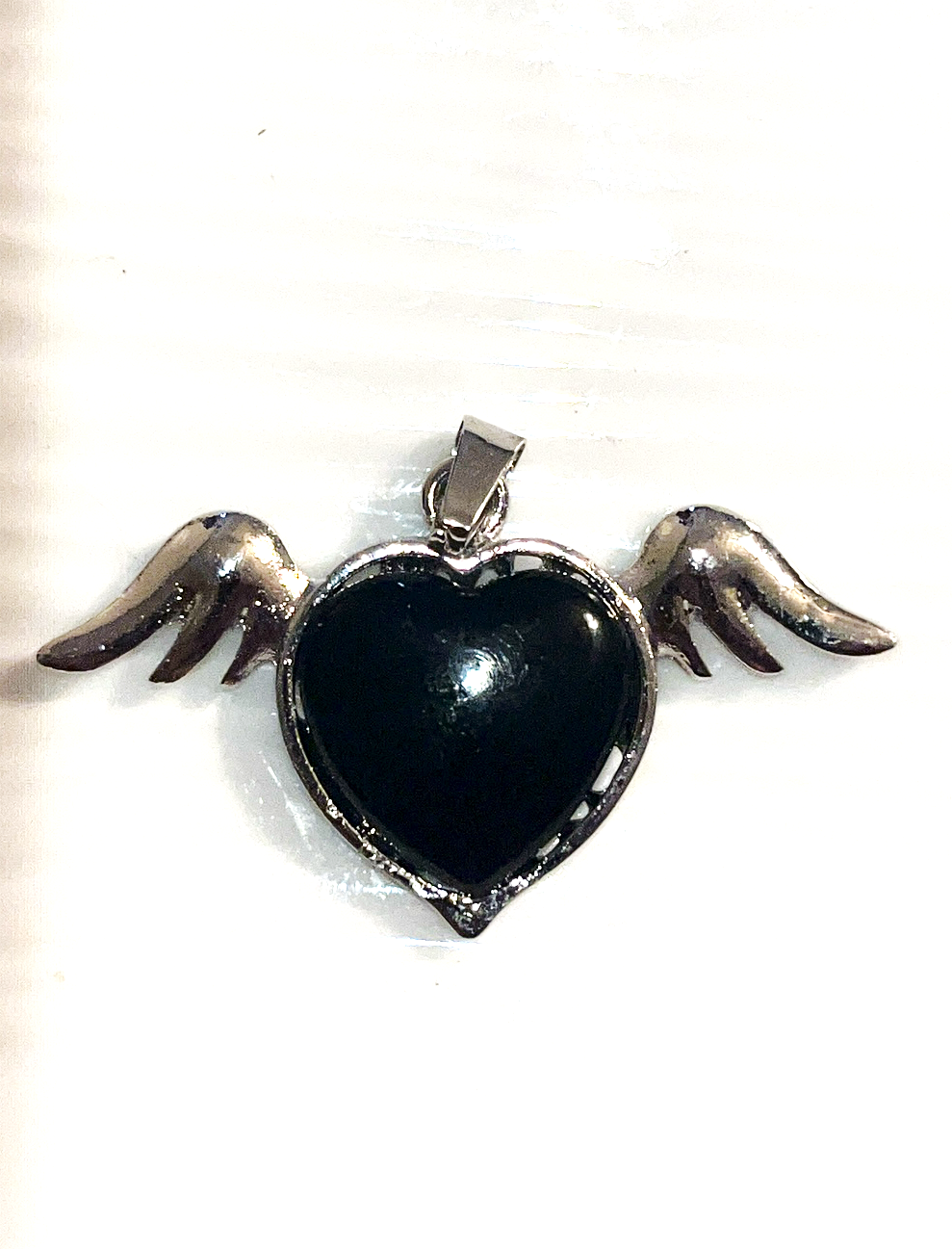 Obsidian flying heart with silver angel wings pendant. Comes with adjustable black rope chain necklace.