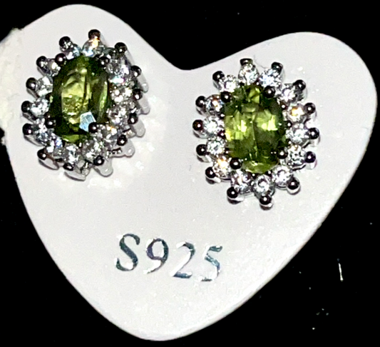 Sterling Silver 925 Natural Peridot oval crystal stud earrings surrounded by Cubic Zirconia stones. Traditional design