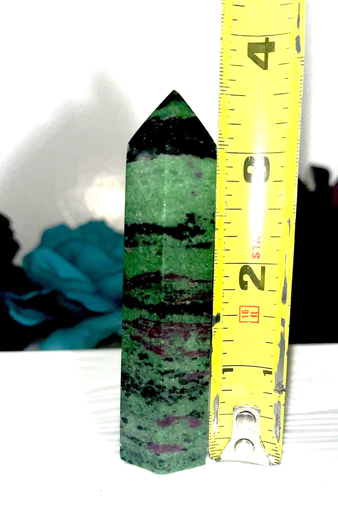 Ruby Zoisite crystal points. UV reactive. Good for grief, hope, fear, doubt, anxiety, deep healing, growth, intuition, courage, protection