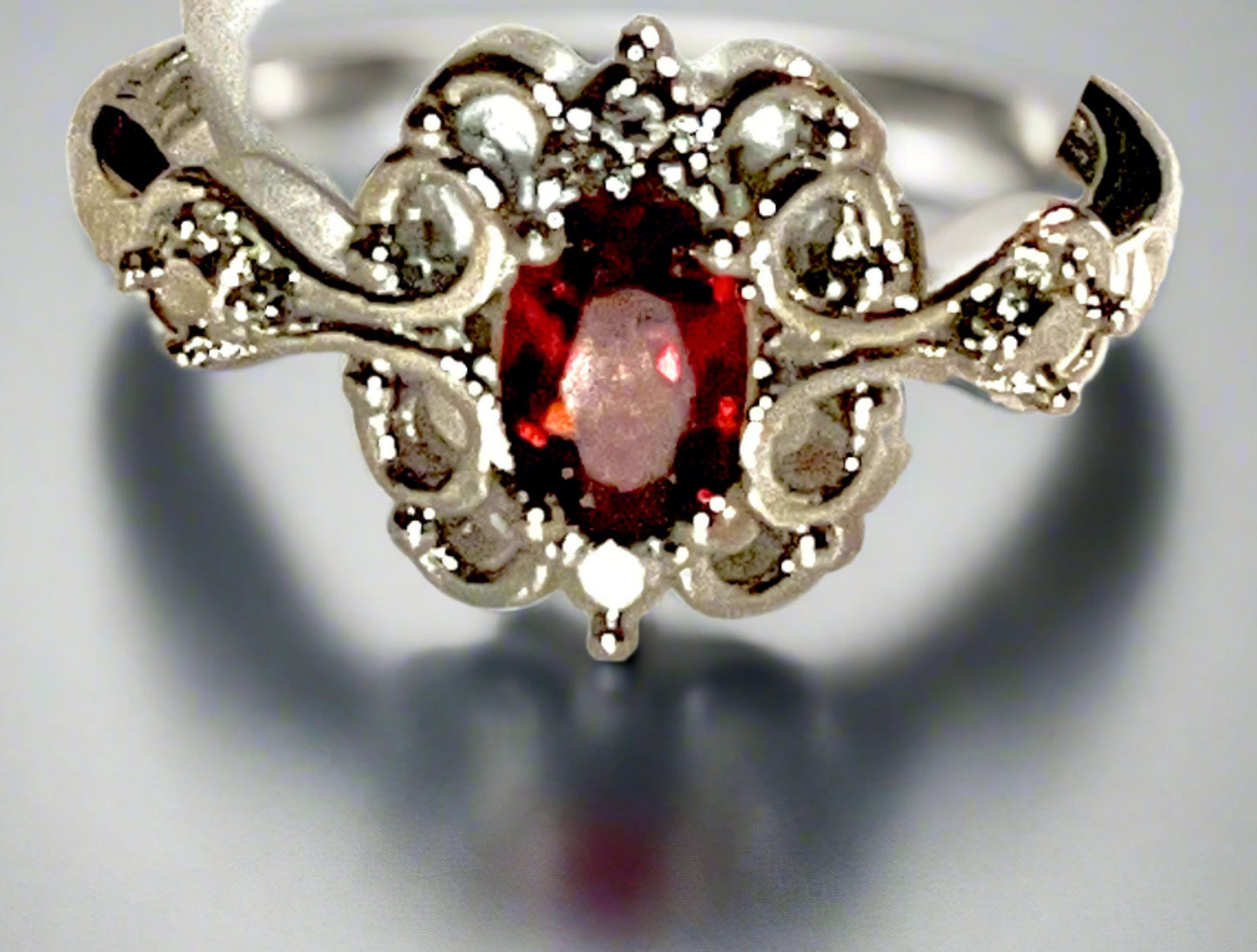 Exquisite Ruby statement ring. Natural gemstone. Adjustable silver band. Symbolizing passion, love, and vitality.
