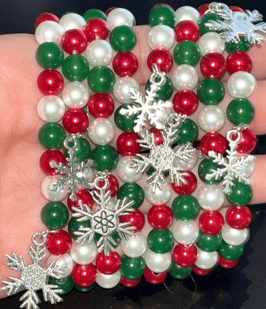 Christmas bead bracelets with pearls and silver snowflake charms. Bring on the holiday cheer!