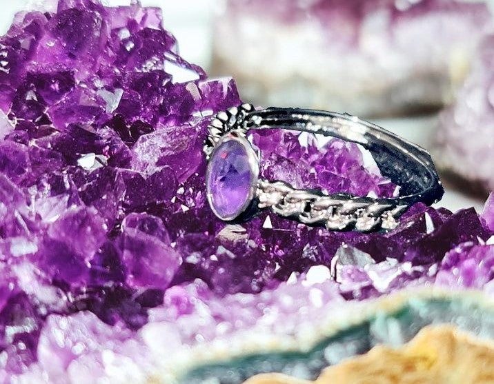 Amethyst oval crystal ring with braided silver style design. Natural gemstone. Adjustable to fit all sizes. Perfect for Valentine's Day!