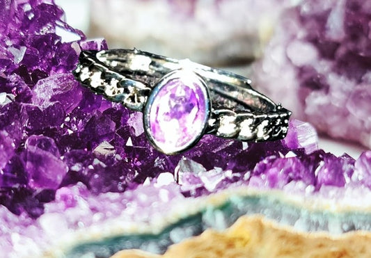 Amethyst oval crystal ring with braided silver style design. Natural gemstone. Adjustable to fit all sizes. Perfect for Valentine's Day!