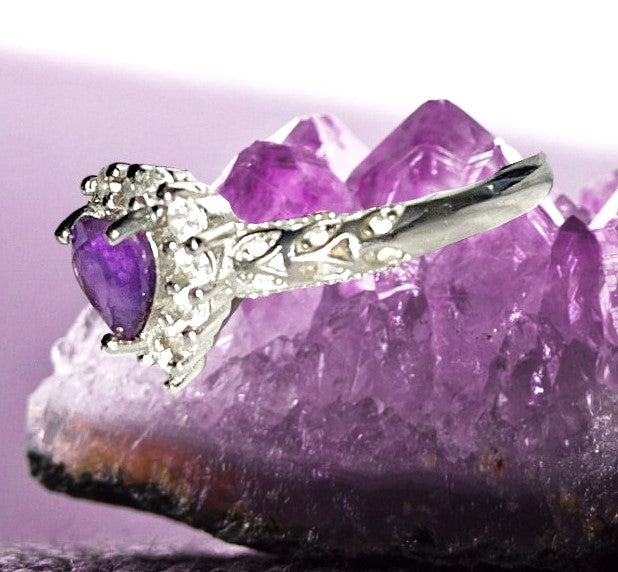 Amethyst heart crystal statement ring surrounded by bling. Natural gemstone. Adjustable to fit all sizes.