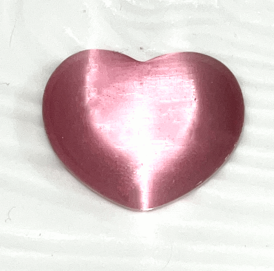 Cats eye gorgeous Crystal hearts- 1.5 inch x 1 inches. Help ward off evil and acts as a talisman to protect against unforeseen danger.