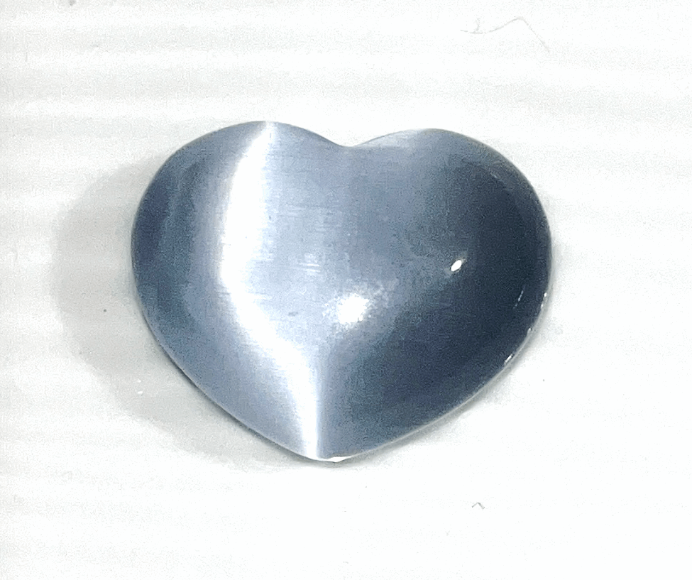 Cats eye gorgeous Crystal hearts- 1.5 inch x 1 inches. Help ward off evil and acts as a talisman to protect against unforeseen danger.