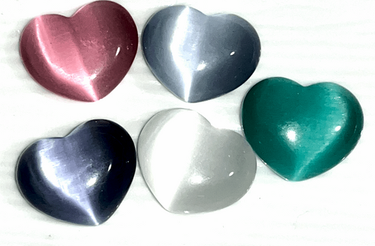 Cats eye gorgeous Crystal hearts- 1.5 inch x 1 inches. Help ward off evil and acts as a talisman to protect against unforeseen danger.