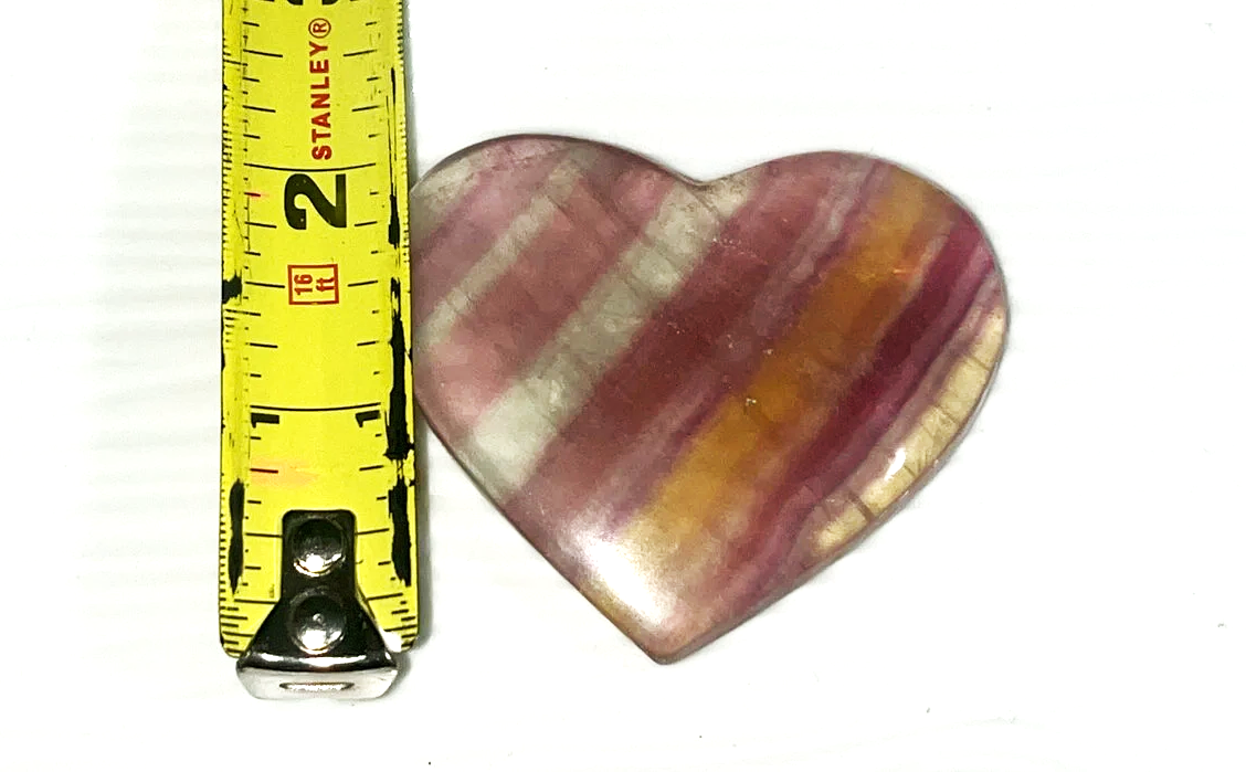 Large yellow, orange & purple Fluorite striped crystal heart carving. Beautiful colors! Brings focus, and peace