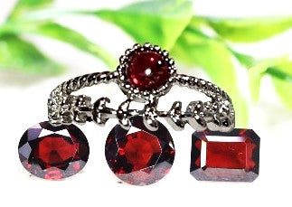 Garnet crystal heart ring. Natural gemstone. Adjustable silver band. Symbolizing passion, love, and vitality.