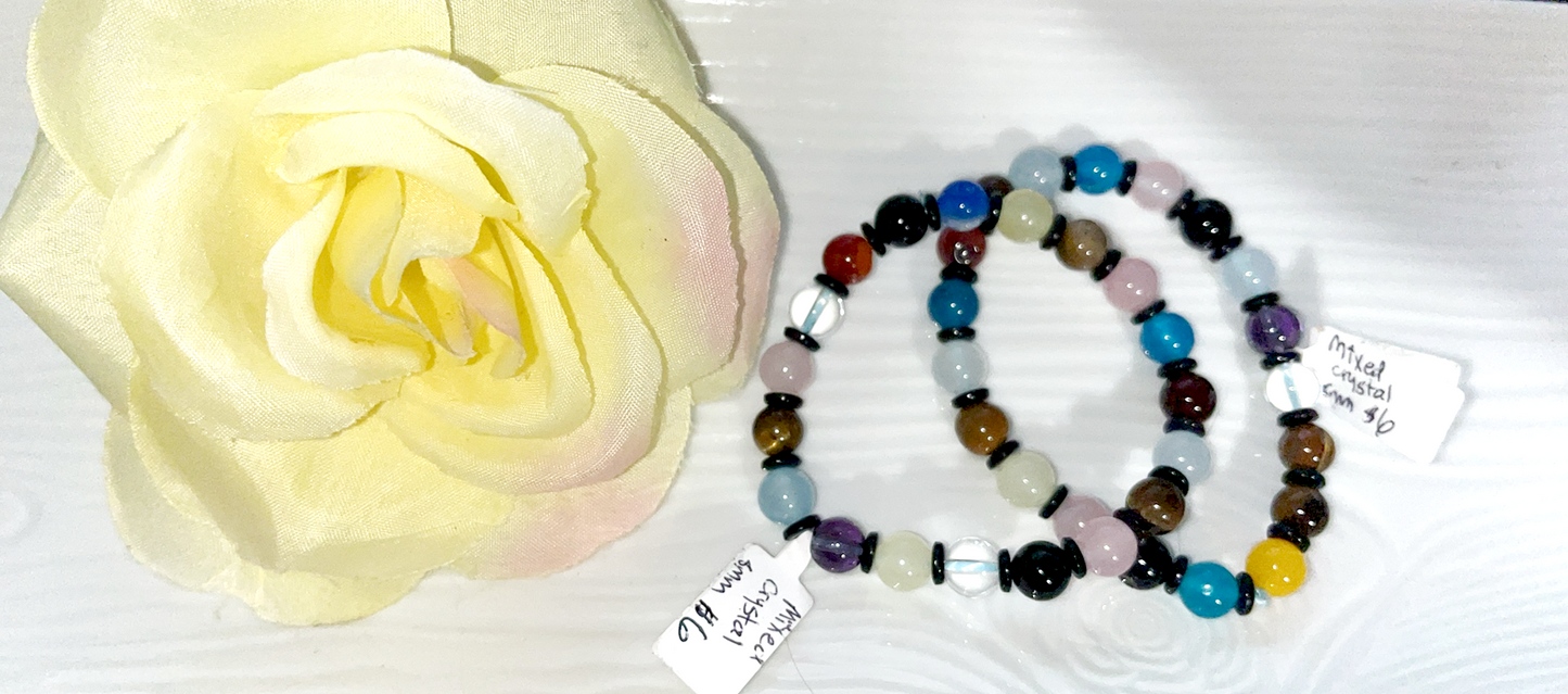 Mixed chakra crystal 8mm bead bracelet with black spacers. Beautiful color pattern