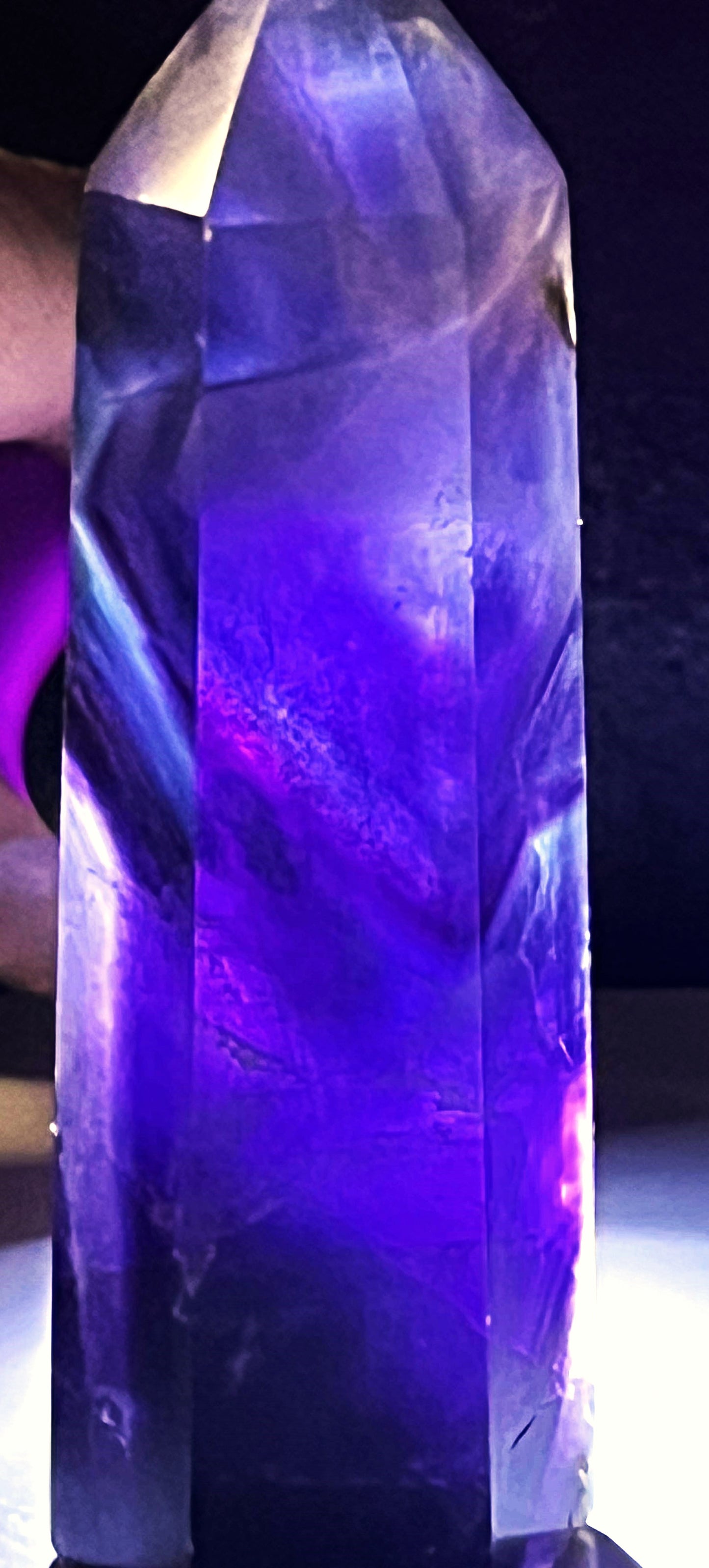 Rainbow Fluorite crystal point with beautiful purple and blue hues. Brings focus, clears mind, enhance intuition, and promote mental clarity