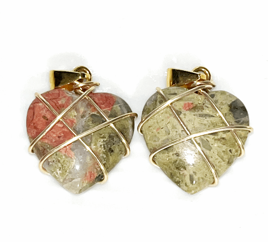 Crystal wire wrapped heart pendants in a variety of materials with black adjustable rope necklace included. Gold wire wrapping.