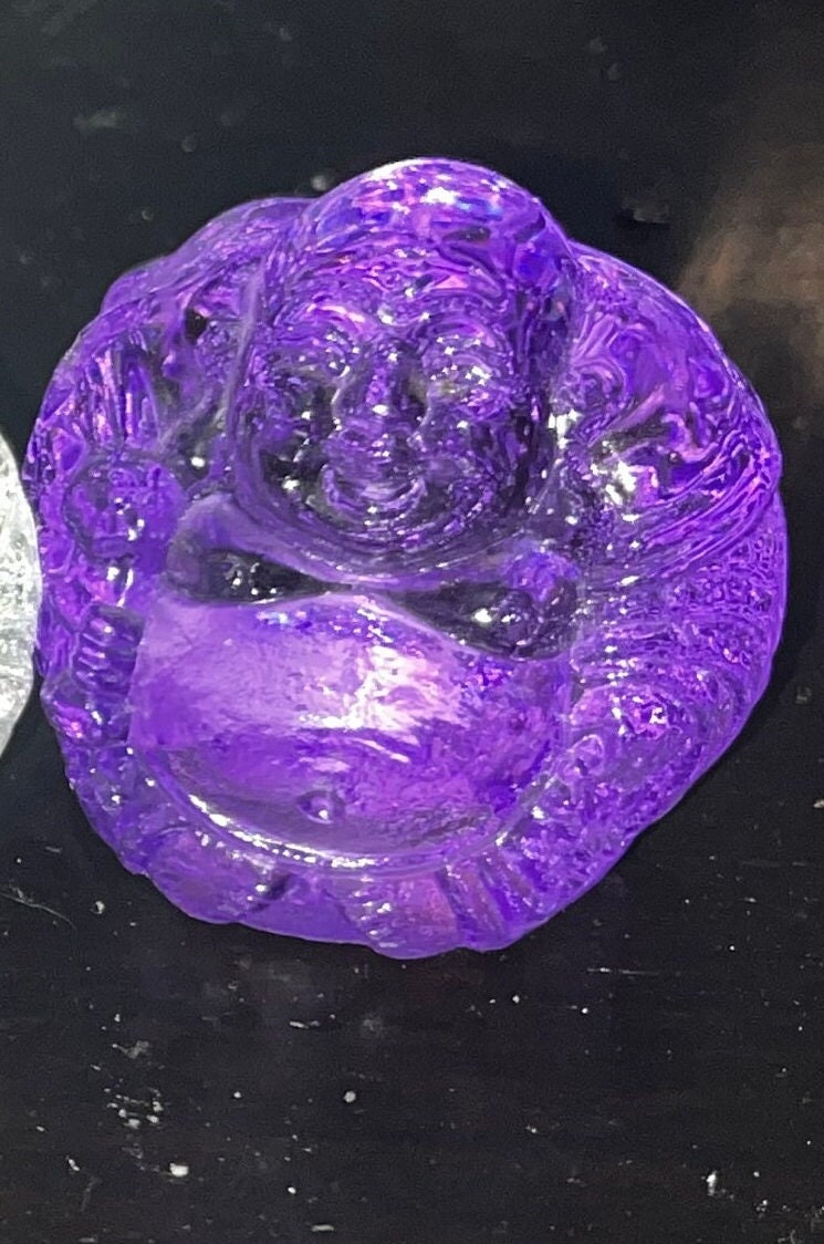 Glass smiling buddha figures, Clear, Blue and Purple. Brings serenity, enlightenment and positivity.