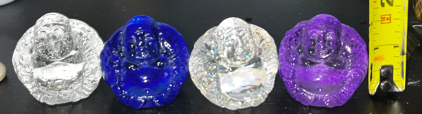 Glass smiling buddha figures, Clear, Blue and Purple. Brings serenity, enlightenment and positivity.